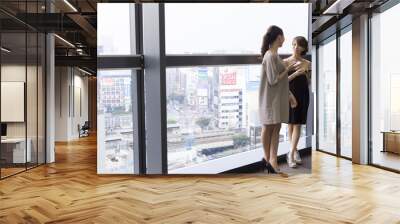 Building fitted with glass　、Two women Wall mural